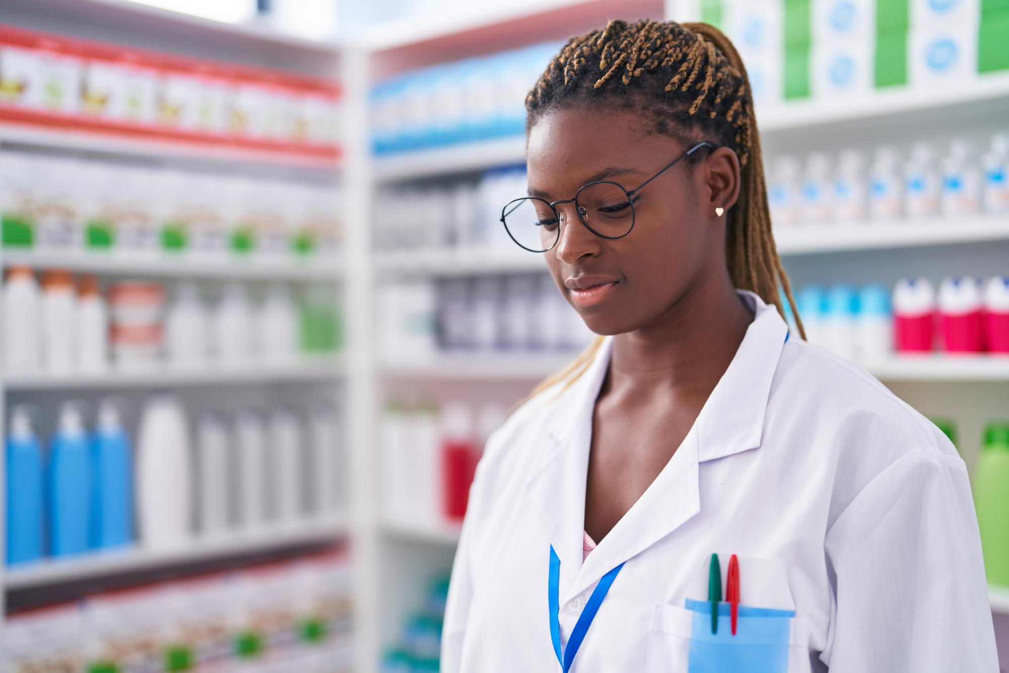 african-american-woman-pharmacist-standing-with-serious-expression-pharmacy